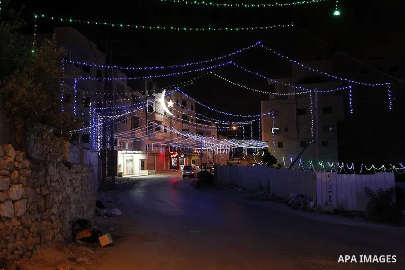 Lighting decorations are seen at a street during the holy fasting month of Ramadan in the West Bank city of Hebron, June 16, 2016. Muslims around the world celebrate Ramadan, the holy month in the Islamic calendar, in wh...