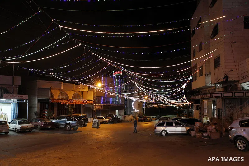 Lighting decorations are seen at a street during the holy fasting month of Ramadan in the West Bank city of Hebron, June 16, 2016. Muslims around the world celebrate Ramadan, the holy month in the Islamic calendar, in wh...