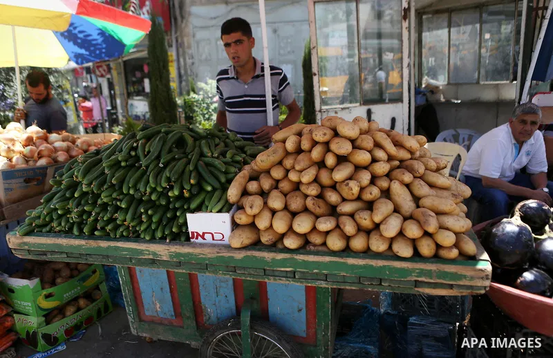 A Palestinian vendor sells fruits at a market on the holy month of Ramadan in the West bank city of Ramallah, on June 16, 2016. Ramadan is sacred to Muslims because it is during that month that tradition says the Koran w...