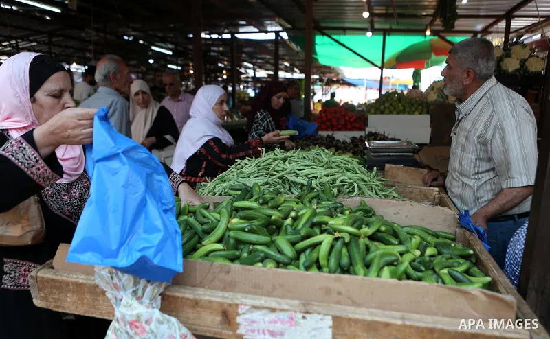 A Palestinian vendor sells fruits at a market on the holy month of Ramadan in the West bank city of Ramallah, on June 16, 2016. Ramadan is sacred to Muslims because it is during that month that tradition says the Koran w...