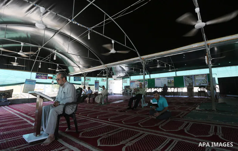 Palestinian Muslim worshippers perform the second Friday prayers of the holy Muslim fasting month of Ramadan at a mosque which was destroyed during the 50-day war between Israel and Hamas militants in the summer of 2014,...