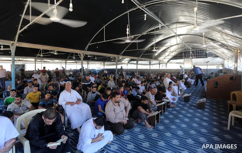 Palestinian Muslim worshippers perform the second Friday prayers of the holy Muslim fasting month of Ramadan at a mosque which was destroyed during the 50-day war between Israel and Hamas militants in the summer of 2014,...