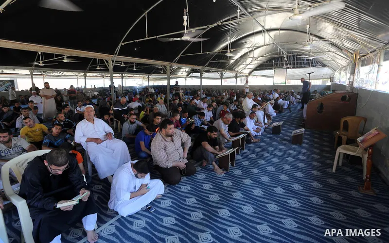 Palestinian Muslim worshippers perform the second Friday prayers of the holy Muslim fasting month of Ramadan at a mosque which was destroyed during the 50-day war between Israel and Hamas militants in the summer of 2014,...