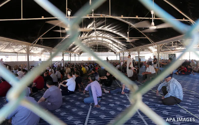 Palestinian Muslim worshippers perform the second Friday prayers of the holy Muslim fasting month of Ramadan at a mosque which was destroyed during the 50-day war between Israel and Hamas militants in the summer of 2014,...