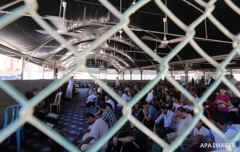 Palestinian Muslim worshippers perform the second Friday prayers of the holy Muslim fasting month of Ramadan at a mosque which was destroyed during the 50-day war between Israel and Hamas militants in the summer of 2014,...