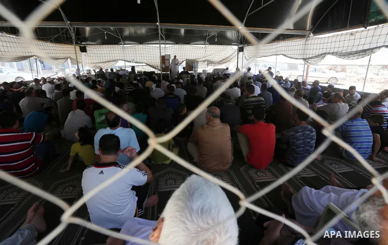 Palestinian Muslim worshippers perform the second Friday prayers of the holy Muslim fasting month of Ramadan at a mosque which was destroyed during the 50-day war between Israel and Hamas militants in the summer of 2014,...