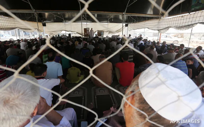 Palestinian Muslim worshippers perform the second Friday prayers of the holy Muslim fasting month of Ramadan at a mosque which was destroyed during the 50-day war between Israel and Hamas militants in the summer of 2014,...