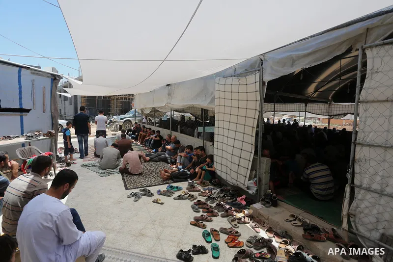 Palestinian Muslim worshippers perform the second Friday prayers of the holy Muslim fasting month of Ramadan at a mosque which was destroyed during the 50-day war between Israel and Hamas militants in the summer of 2014,...