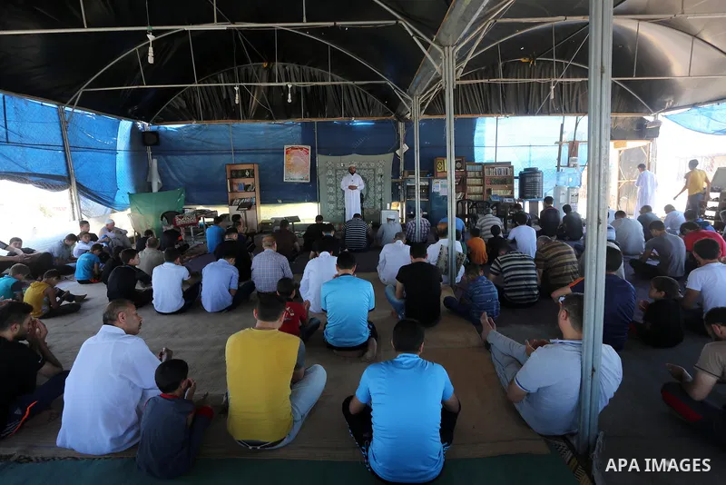 Palestinian Muslim worshippers perform the second Friday prayers of the holy Muslim fasting month of Ramadan at a mosque which was destroyed during the 50-day war between Israel and Hamas militants in the summer of 2014,...