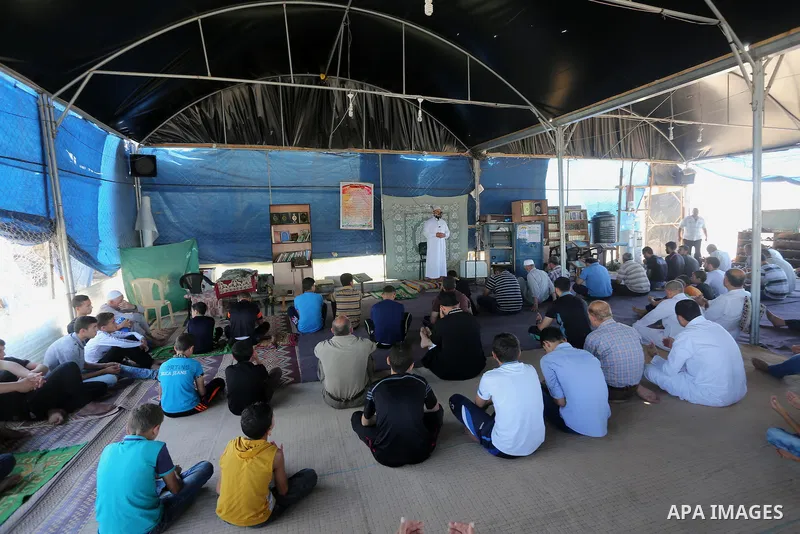 Palestinian Muslim worshippers perform the second Friday prayers of the holy Muslim fasting month of Ramadan at a mosque which was destroyed during the 50-day war between Israel and Hamas militants in the summer of 2014,...