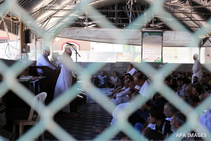 Palestinian Muslim worshippers perform the second Friday prayers of the holy Muslim fasting month of Ramadan at a mosque which was destroyed during the 50-day war between Israel and Hamas militants in the summer of 2014,...