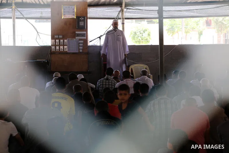 Palestinian Muslim worshippers perform the second Friday prayers of the holy Muslim fasting month of Ramadan at a mosque which was destroyed during the 50-day war between Israel and Hamas militants in the summer of 2014,...