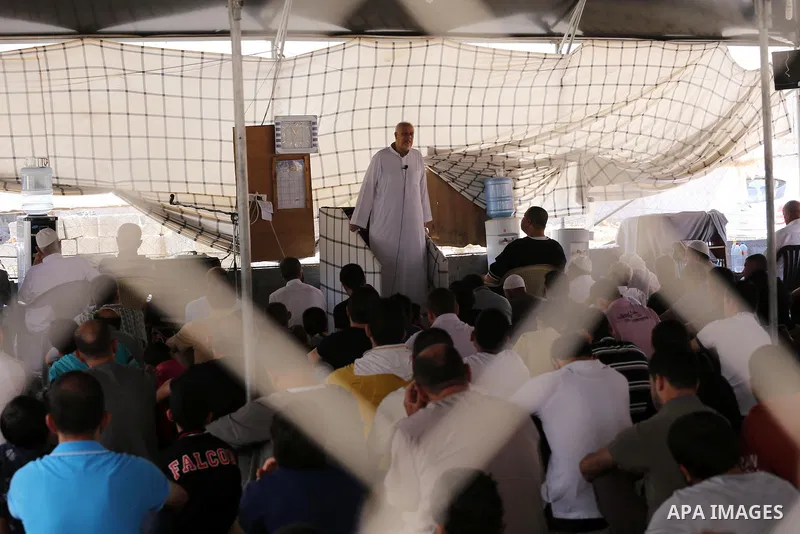 Palestinian Muslim worshippers perform the second Friday prayers of the holy Muslim fasting month of Ramadan at a mosque which was destroyed during the 50-day war between Israel and Hamas militants in the summer of 2014,...
