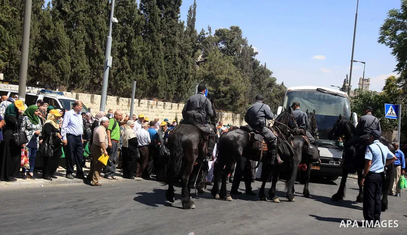 Israeli police prevent Palestinian Muslim worshippers from leaving the old city following Friday prayer at al-Aqsa mosque on June 17, 2016 during the holy fasting month of Ramadan. Around 53,000 Palestinians from the Wes...