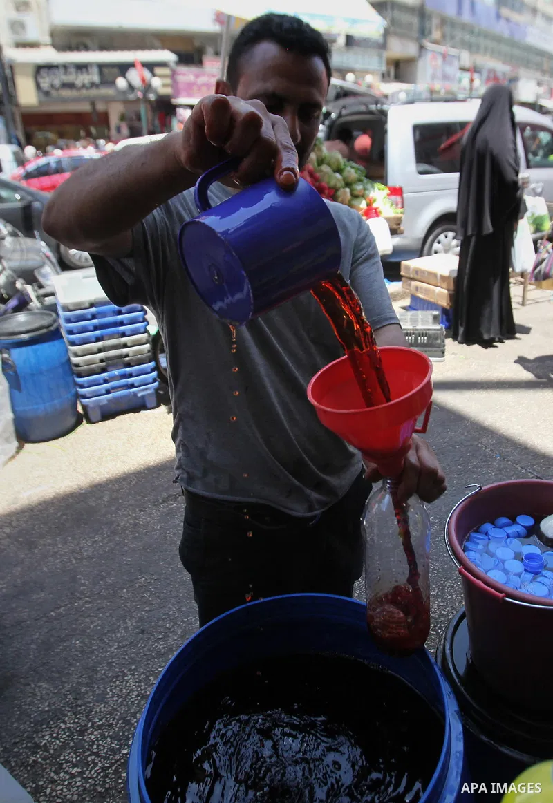 A Palestinian vendor prepares juices on the holy month of Ramadan at a market in the West bank city of Nablus, on June 18, 2016. Ramadan is sacred to Muslims because it is during that month that tradition says the Koran...