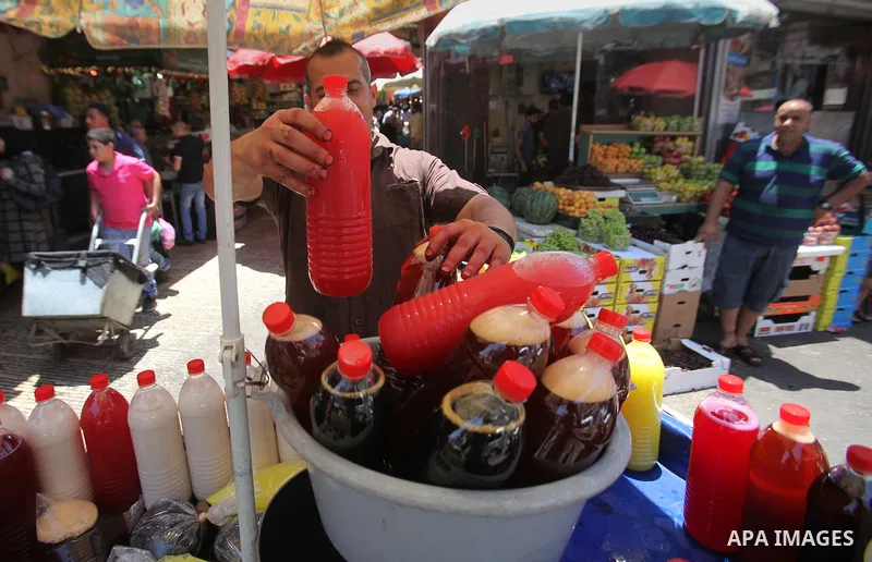 A Palestinian vendor prepares juices on the holy month of Ramadan at a market in the West bank city of Nablus, on June 18, 2016. Ramadan is sacred to Muslims because it is during that month that tradition says the Koran...