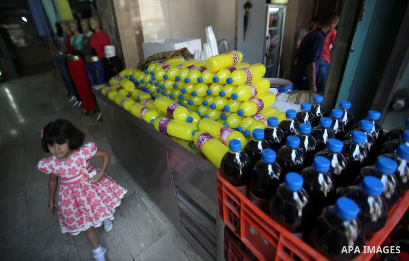 A Palestinian vendor prepares juices on the holy month of Ramadan at a market in the West bank city of Nablus, on June 18, 2016. Ramadan is sacred to Muslims because it is during that month that tradition says the Koran...