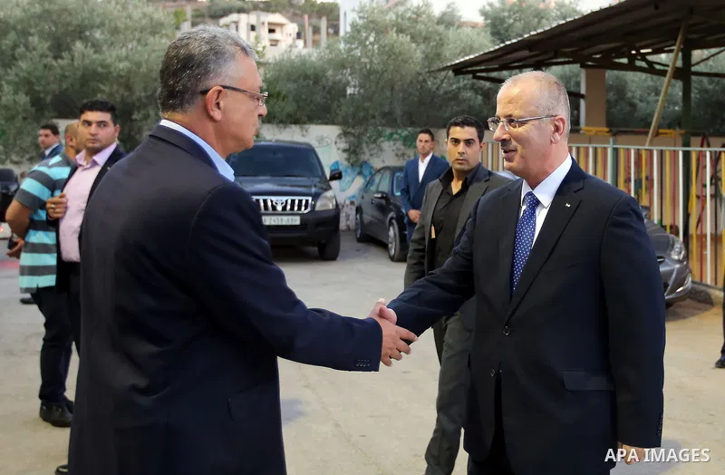 Palestinian Prime Minister Rami Hamdallah takes part during take breakfast for orphans on holy fasting month of Ramadan, in the West Bank city of Tulkarem, on June 18, 2016. Photo by Prime Minister Office