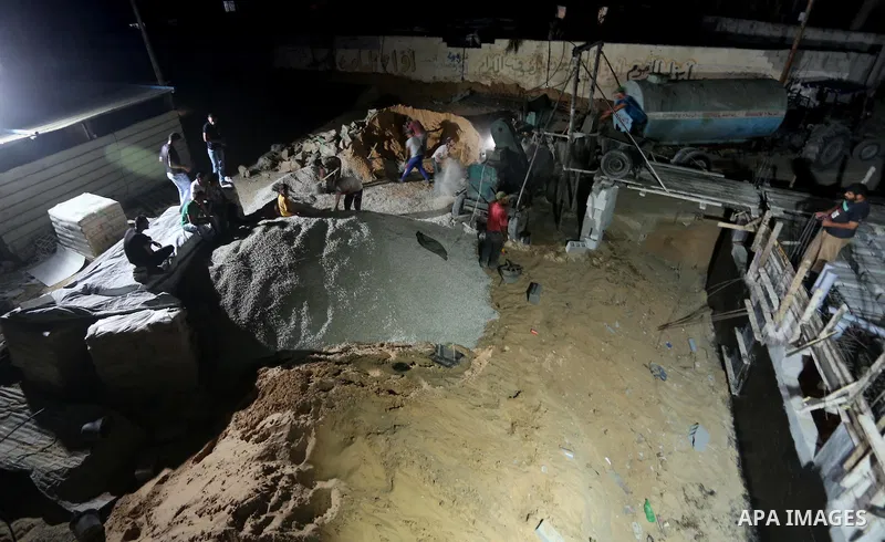 Palestinian construction workers work in Shajaiyeh neighborhood in Gaza city, on June 18, 2016. Palestinian construction workers work during the night in the month of Ramadan because of the high temperatures they can not...