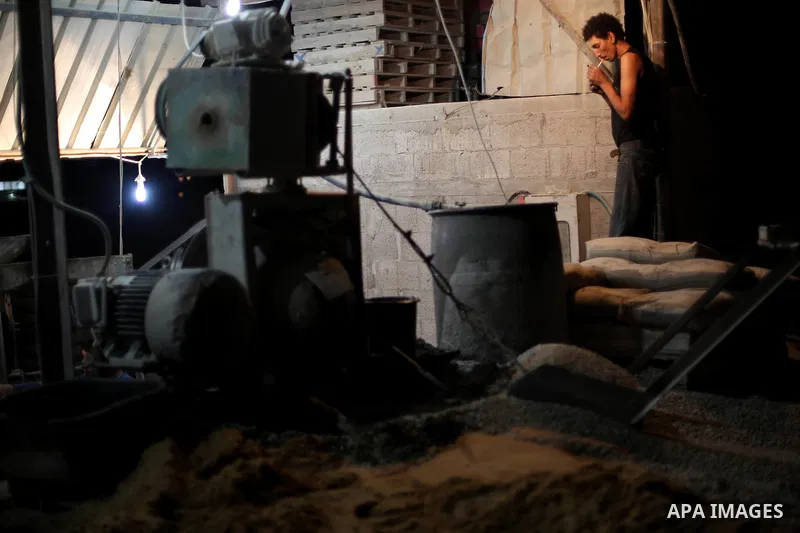 Palestinian construction workers work in Shajaiyeh neighborhood in Gaza city, on June 18, 2016. Palestinian construction workers work during the night in the month of Ramadan because of the high temperatures they can not...
