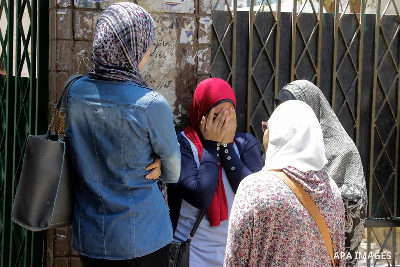 Egyptian students react outside their school following the final high school exams known as ''Tawjihi'', in Cairo on June 19, 2016. Photo by Amr Sayed