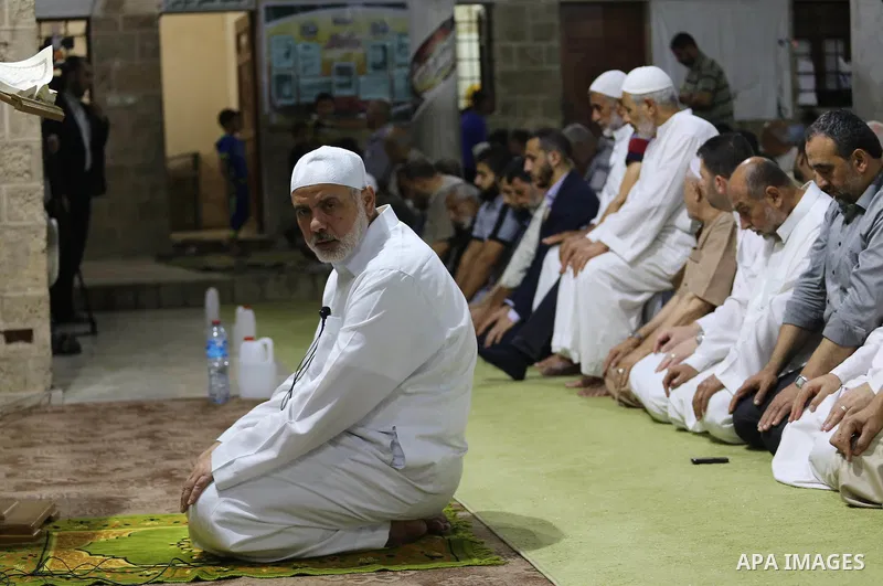 Senior Hamas leader Ismail Haniyeh, performs "Taraweeh", nightly prayer of the month of Ramadan in Gaza city on June 19, 2016. Ramadan is sacred to Muslims because it is during that month that tradition says the Koran wa...