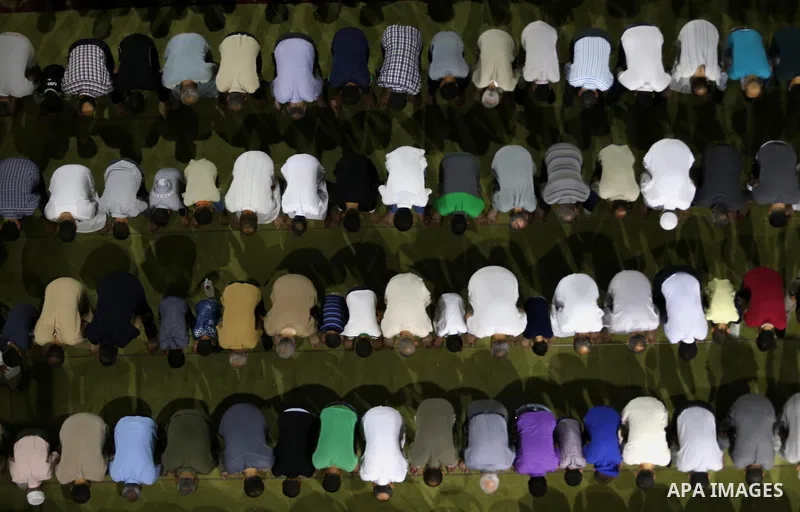 Palestinian Muslim worshipers perform "Taraweeh", nightly prayer of the month of Ramadan in Gaza city on June 19, 2016. Ramadan is sacred to Muslims because it is during that month that tradition says the Koran was revea...