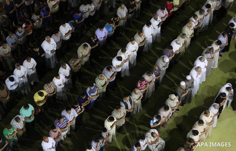 Palestinian Muslim worshipers perform "Taraweeh", nightly prayer of the month of Ramadan in Gaza city on June 19, 2016. Ramadan is sacred to Muslims because it is during that month that tradition says the Koran was revea...