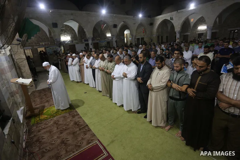 Senior Hamas leader Ismail Haniyeh, performs "Taraweeh", nightly prayer of the month of Ramadan in Gaza city on June 19, 2016. Ramadan is sacred to Muslims because it is during that month that tradition says the Koran wa...