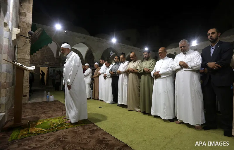 Senior Hamas leader Ismail Haniyeh, performs "Taraweeh", nightly prayer of the month of Ramadan in Gaza city on June 19, 2016. Ramadan is sacred to Muslims because it is during that month that tradition says the Koran wa...