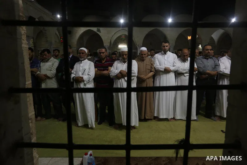 Palestinian Muslim worshipers perform "Taraweeh", nightly prayer of the month of Ramadan in Gaza city on June 19, 2016. Ramadan is sacred to Muslims because it is during that month that tradition says the Koran was revea...