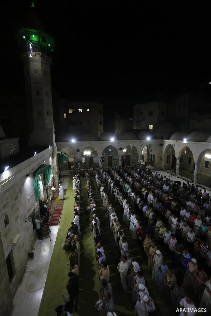 Palestinian Muslim worshipers perform "Taraweeh", nightly prayer of the month of Ramadan in Gaza city on June 19, 2016. Ramadan is sacred to Muslims because it is during that month that tradition says the Koran was revea...