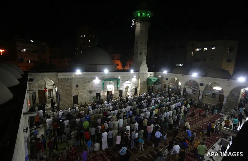 Palestinian Muslim worshipers perform "Taraweeh", nightly prayer of the month of Ramadan in Gaza city on June 19, 2016. Ramadan is sacred to Muslims because it is during that month that tradition says the Koran was revea...