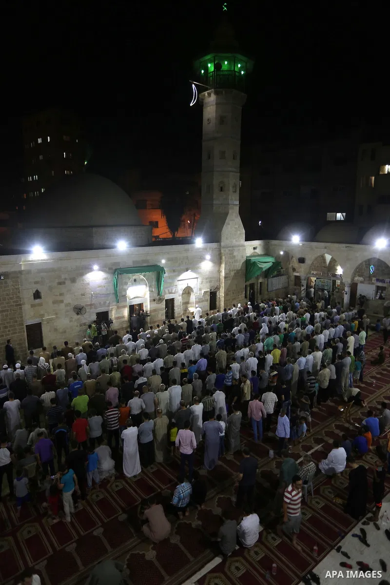 Palestinian Muslim worshipers perform "Taraweeh", nightly prayer of the month of Ramadan in Gaza city on June 19, 2016. Ramadan is sacred to Muslims because it is during that month that tradition says the Koran was revea...