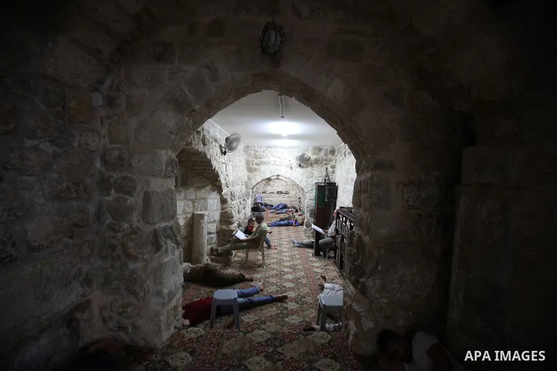Palestinian men sleep at al-Hanbali mosque during the holy month of Ramadan, in the West bank city of Nablus, on June 20, 2016. Ramadan is sacred to Muslims because it is during that month that tradition says the Koran w...