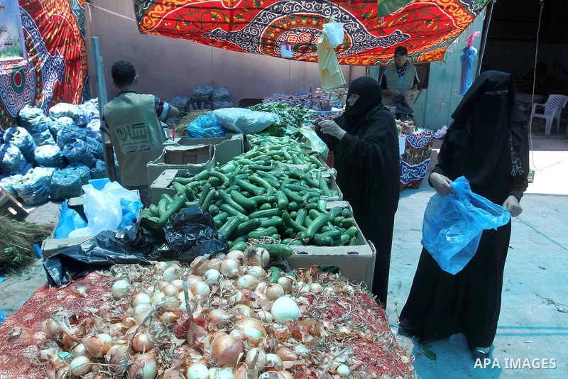 Palestinians shop at the Ramadan Charity market for poor families, Funded by "Gift of the Givers" South Africa, in Khan Younis in the southern Gaza strip, on June 20, 2016. Photo by Abed Rahim Khatib