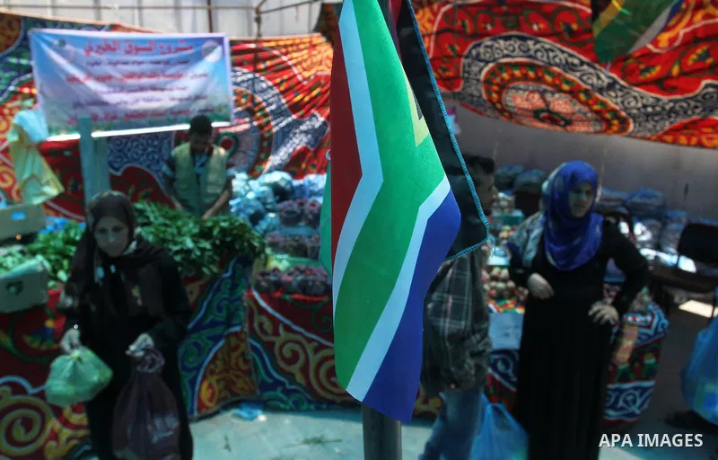 Palestinians shop at the Ramadan Charity market for poor families, Funded by "Gift of the Givers" South Africa, in Khan Younis in the southern Gaza strip, on June 20, 2016. Photo by Abed Rahim Khatib