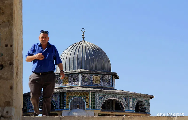 A Palestinian man walks following (Asr) prayer during the holy fasting month of Ramadan at al-Aqsa mosque, in Jerusalem's old city on June 20, 2016. Ramadan is sacred to Muslims because it is during that month that tradi...