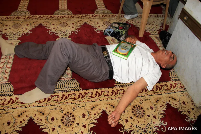 A Palestinian Muslim worshipper sleep at al-Aqsa mosque, in Jerusalem's old city on June 20, 2016. Ramadan is sacred to Muslims because it is during that month that tradition says the Koran was revealed to the Prophet Mo...