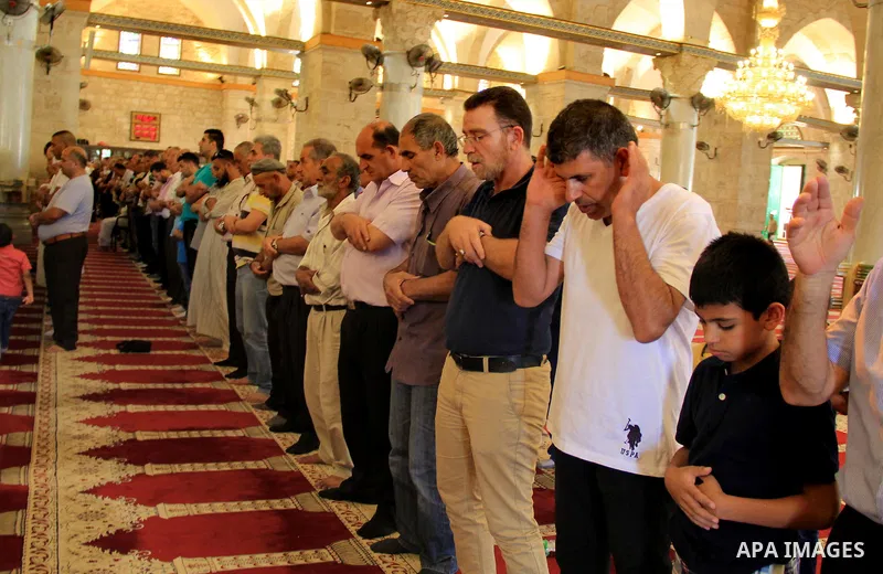 Palestinian Muslim worshippers perform the afternoon (Asr) prayer during the holy fasting month of Ramadan at al-Aqsa mosque, in Jerusalem's old city on June 20, 2016. Ramadan is sacred to Muslims because it is during th...