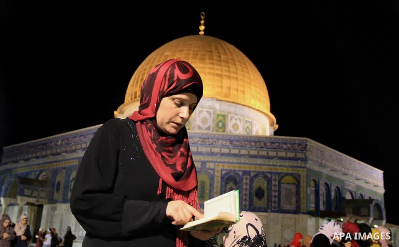 Palestinian Muslim worshippers perform "Taraweeh", nightly prayer of the month of Ramadan, in front of the Dome of the Rock mosque, in Jerusalem's old city on June 20, 2016. Ramadan is sacred to Muslims because it is dur...