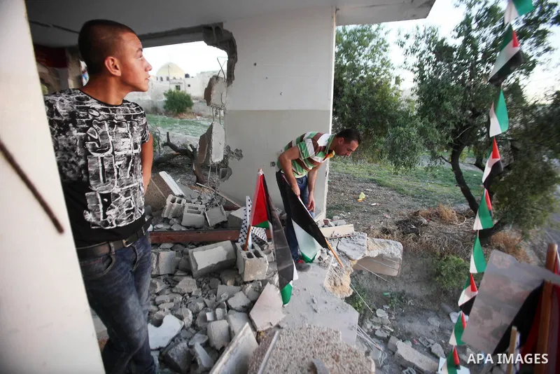 Palestinians inspect the home of the Bashar Masalha that was demolished by the Israeli military in the West bank city of Qalqilya, on June 21, 2016. Bashar Masalha was killed in Jaffa city on 8 March 2016, under the pret...