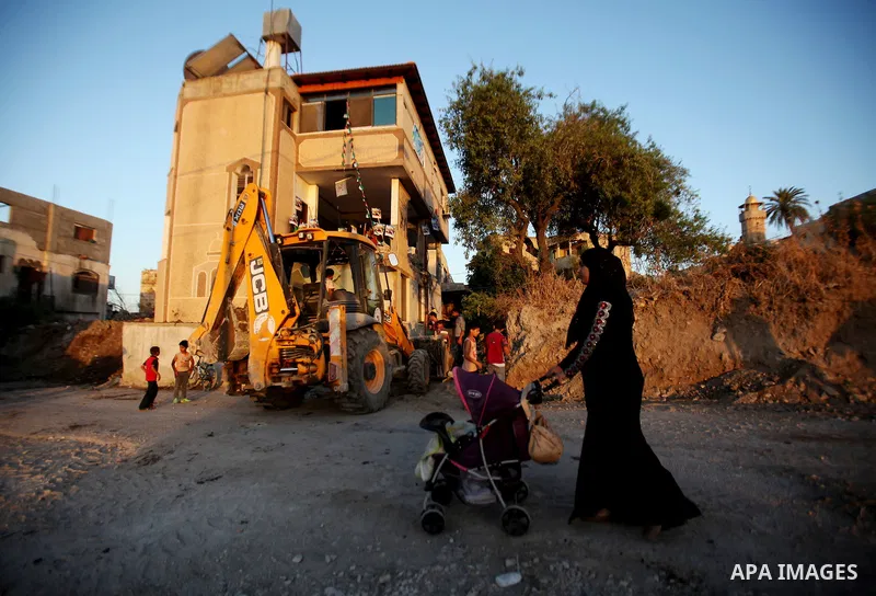 Palestinians inspect the home of the Bashar Masalha that was demolished by the Israeli military in the West bank city of Qalqilya, on June 21, 2016. Bashar Masalha was killed in Jaffa city on 8 March 2016, under the pret...