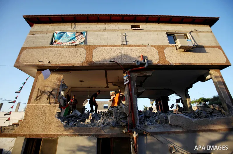 Palestinians inspect the home of the Bashar Masalha that was demolished by the Israeli military in the West bank city of Qalqilya, on June 21, 2016. Bashar Masalha was killed in Jaffa city on 8 March 2016, under the pret...