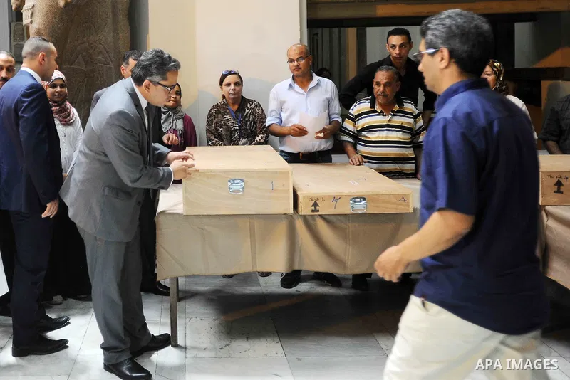 Egyptian antiquities officials carry a lid of a sarcophagus on its arrival to the Egyptian Museum in Cairo, Egypt, on June 21, 2016. Two ancient Egyptian sarcophagus covers have been delivered to Cairo's Egyptian Museum...