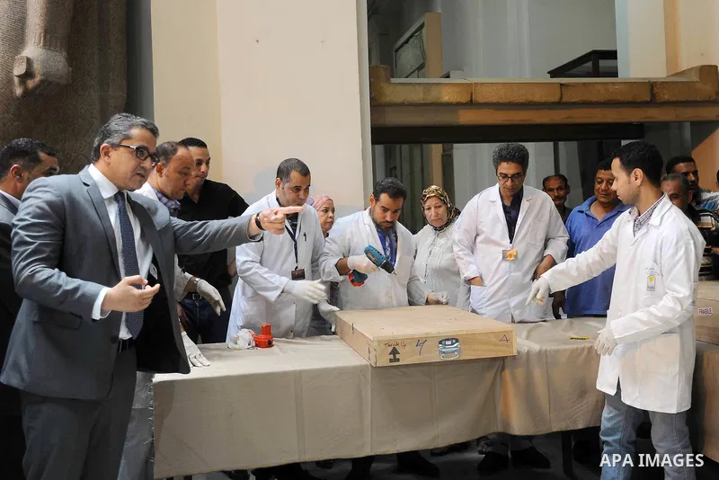 Egyptian antiquities officials carry a lid of a sarcophagus on its arrival to the Egyptian Museum in Cairo, Egypt, on June 21, 2016. Two ancient Egyptian sarcophagus covers have been delivered to Cairo's Egyptian Museum...