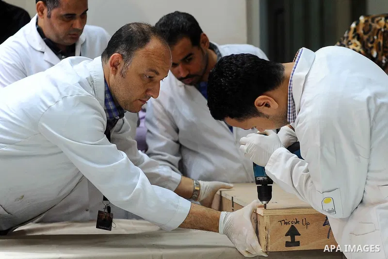 Egyptian antiquities officials carry a lid of a sarcophagus on its arrival to the Egyptian Museum in Cairo, Egypt, on June 21, 2016. Two ancient Egyptian sarcophagus covers have been delivered to Cairo's Egyptian Museum...