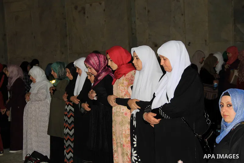 Palestinian Muslim worshippers perform "Taraweeh", nightly prayer of the month of Ramadan, in front of the Dome of the Rock mosque, in Jerusalem's old city on June 21, 2016. Ramadan is sacred to Muslims because it is dur...