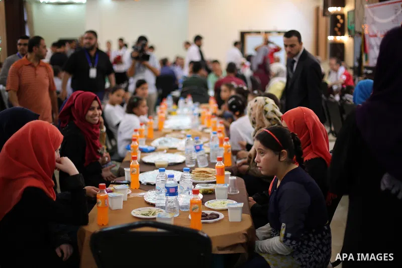 Palestinian orphan children break their fast during the holy fasting month of Ramadan in Gaza city on June 22, 2016. Ramadan is sacred to Muslims because it is during that month that tradition says the Koran was revealed...
