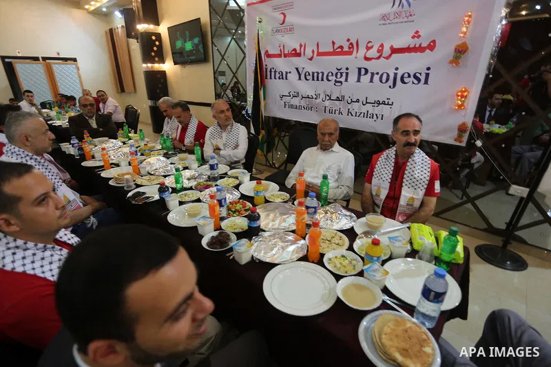 Palestinian orphan children break their fast during the holy fasting month of Ramadan in Gaza city on June 22, 2016. Ramadan is sacred to Muslims because it is during that month that tradition says the Koran was revealed...